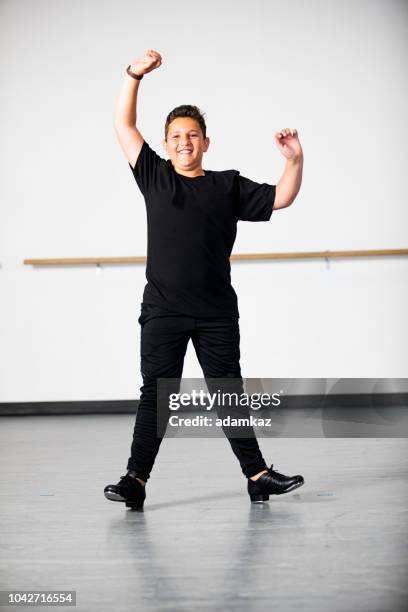 boy practicing tap dancing - riverdance show stock pictures, royalty-free photos & images
