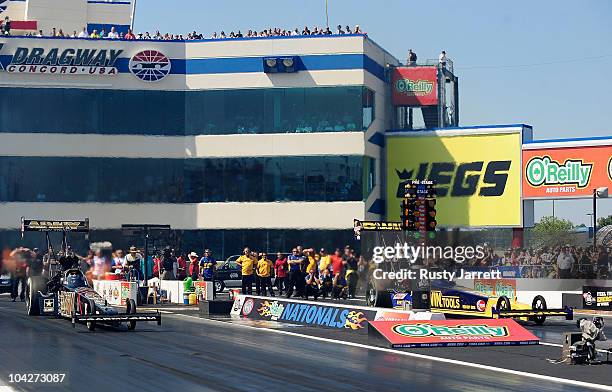 Tony Schumacher, driver of the US Army Top Fuel Dragster Doug Herbert, driver of the Irwin Tools Top Fuel Dragster during the O'Reilly Auto Parts...