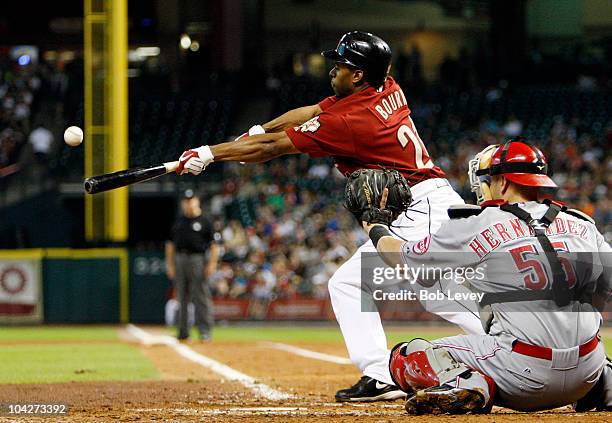 Michael Bourn of the Houston Astros lays down a bunt against the Cincinnatti Reds at Minute Maid Park on September 19, 2010 in Houston, Texas.