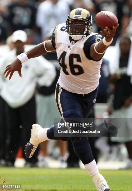 Daniel Fells of the St. Louis Rams makes a one handed catch against the Oakland Raiders during an NFL game at Oakland-Alameda County Coliseum on...