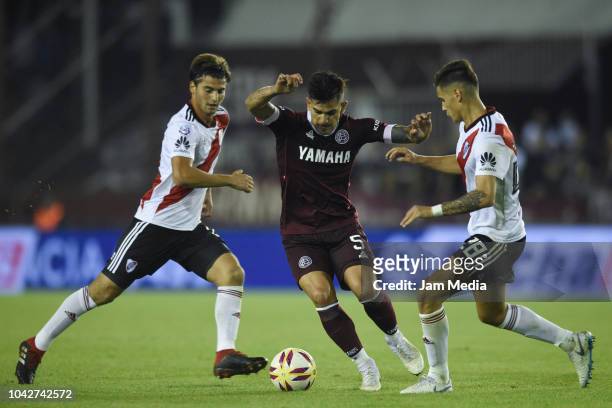 Leandro Maciel of Lanus fights for the ball with Lucas Martinez Quarta of River Plate during a match between Lanus and River Plate as part of...