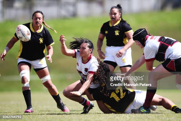 Nikita-Danielle Ngarongo-Porima of North Harbour passes the ball out during the round five Farah Palmer Cup match between North Harbour Hibiscus and...