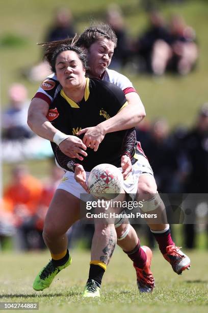 Bernadette Robertson of Wellington is brought down during the round five Farah Palmer Cup match between North Harbour Hibiscus and Wellington Pride...