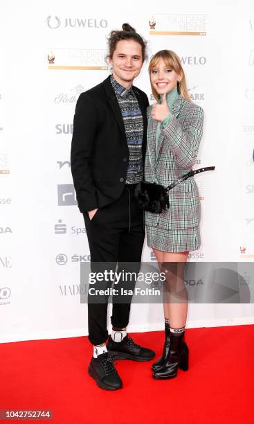 German actor Tilman Poerzgen and German actress and singer Lina Larissa Strahl during the Goldene Henne on September 28, 2018 in Leipzig, Germany.