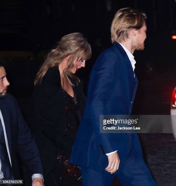Taylor Swift and Joe Alwyn hold hands as they return home on September 29, 2018 in New York City.