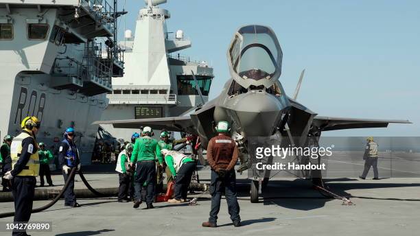 In this handout image provided by the Ministry of Defence, An F-35B fighter jet onboard HMS Queen Elizabeth on September 26, 2018 in Portsmouth,...