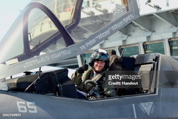 In this handout image provided by the Ministry of Defence, Royal Navy Commander, Nathan Gray in his F35B gives a celebratory thumbs up after...
