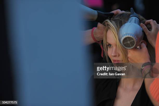 Model prepares backstage for the Matthew Williamson Spring/Summer 2011 fashion show at Battersea Power Station during London Fashion Week on...