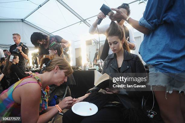 Models prepare backstage for the Matthew Williamson Spring/Summer 2011 fashion show at Battersea Power Station during London Fashion Week on...