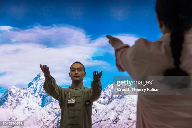 Zhang Yuxuan, a martial arts champion, runs a taichi workshop during the Annual Meeting of the New Champions of the World Economic Forum held in...