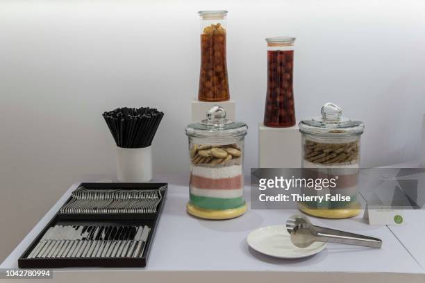 Fruit jars and cookies are displayed at a buffet at the Annual Meeting of the New Champions of the World Economic Forum held in Tianjin from...