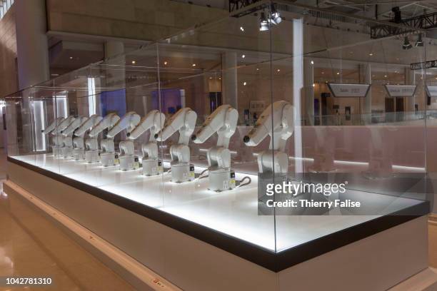 Manus, a project designed by Madeline Gannon where interconnected industrial robots interact with humans, is displayed at the Annual Meeting of the...