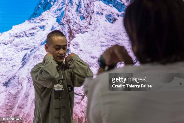 Zhang Yuxuan, a martial arts champion, runs a taichi workshop during the Annual Meeting of the New Champions of the World Economic Forum held in...