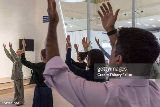 Participants attend a taichi workshop during the Annual Meeting of the New Champions of the World Economic Forum held in Tianjin from September 18 to...