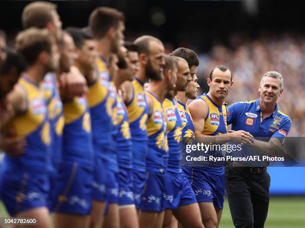 Adam Simpson, Senior Coach of the Eagles, and Shannon Hurn of the Eagles looks on before during the 2018 AFL Grand Final match between the...