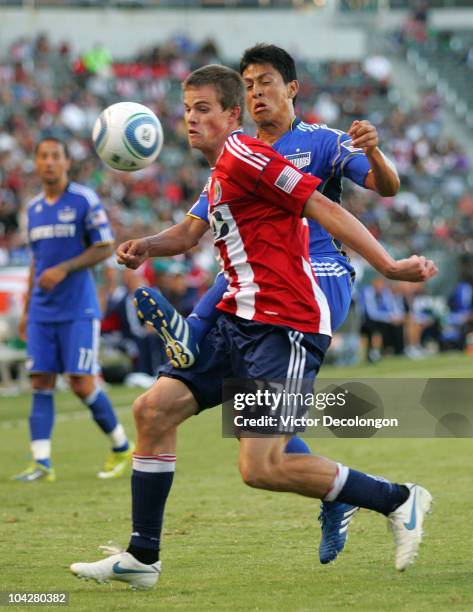 Justin Braun of Chivas USA wins position to the ball against Roger Espinoza of the Kansas City Wizards during their MLS match at The Home Depot...