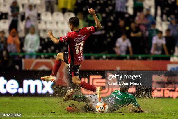 Bryan Rabello of Lobos BUAP and Andres Mosquera of Leon fight for the ball during the 10th round match between Leon and Lobos BUAP as part of the...