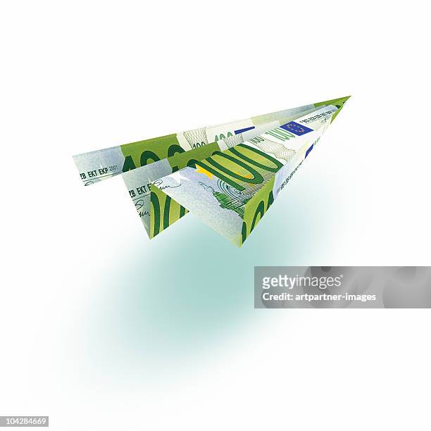 100 euro paperflier or paper plane on white - one hundred euro banknote stock pictures, royalty-free photos & images
