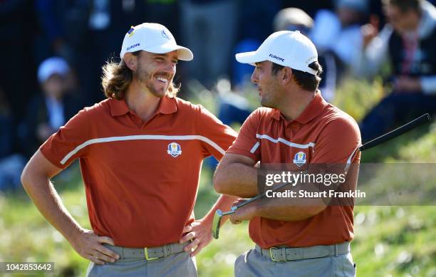 Tommy Fleetwood of Europe and Francesco Molinari of Europe in conversation during the afternoon foursome matches of the 2018 Ryder Cup at Le Golf...