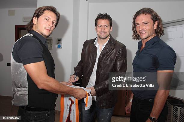 Michele Malenotti, Alex Daniel Pena and Manuele Malenotti attend the Belstaff Official Meeting with AS Roma football team at the AS Roma headquarters...