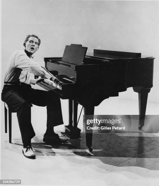 Jerry Lee Lewis poses for a studio portrait in 1957 in the United States.