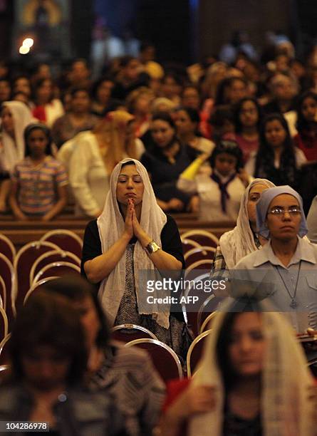 Egyptian Christians pray during the Easter Coptic Christian mass at Cairo's Abbassiya Cathedral in the early hours of April 4, 2010. Pope Shenuda...