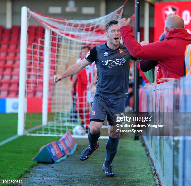 Lincoln City's Shay McCartan celebrates scoring his side's second goal during the Sky Bet League Two match between Cheltenham Town and Lincoln City...