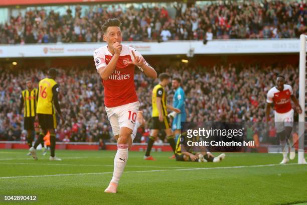 Mesut Ozil of Arsenal celebrates scoring his sides second goal during the Premier League match between Arsenal FC and Watford FC at Emirates Stadium...