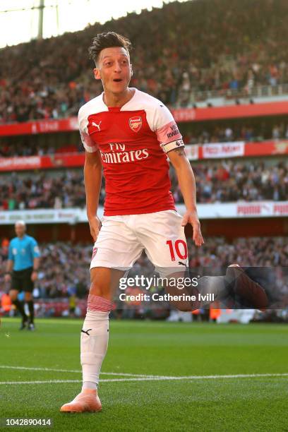 Mesut Ozil of Arsenal celebrates scoring his sides second goal during the Premier League match between Arsenal FC and Watford FC at Emirates Stadium...