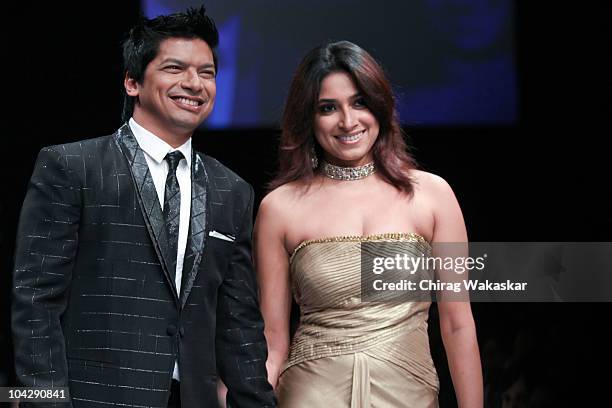 Singer Shaan Mukherjee and Radhika Mukherjee walk the runway in an Troy Costa design at the Lakme Fashion Week Winter Festive 2010 Day 4 at the Grand...