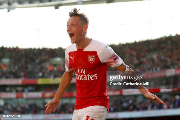 Mesut Ozil of Arsenal celebrates after scoring his team's second goal during the Premier League match between Arsenal FC and Watford FC at Emirates...