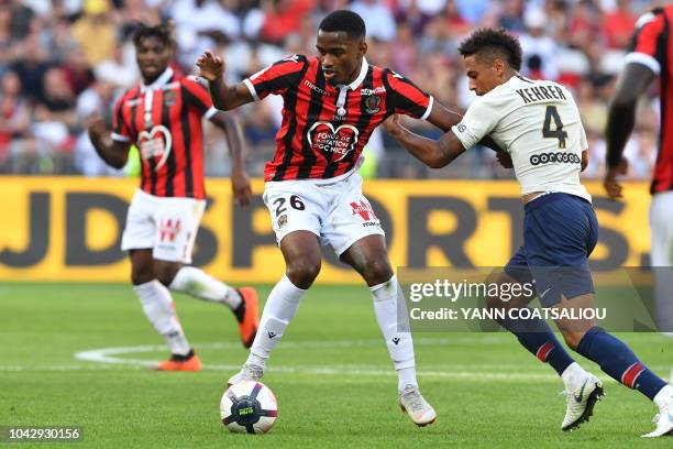 Nice's French midfielder Myziane Maolida vies with Paris Saint-Germain's German defender Thilo Kehrer during the French L1 football match Nice vs...