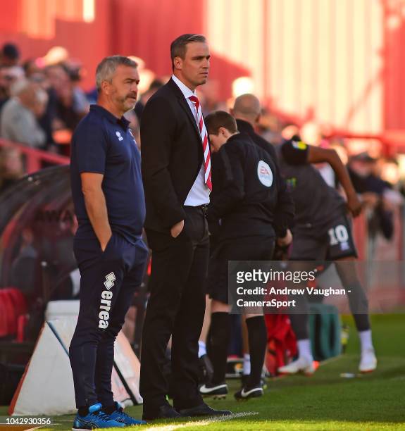 Cheltenham Town manager Michael Duff, second in from left, during the Sky Bet League Two match between Cheltenham Town and Lincoln City at Whaddon...