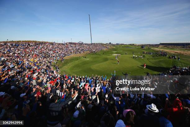 General view as Tommy Fleetwood of Europe celebrates on the ninth green during the 2018 Ryder Cup at Le Golf National on September 29, 2018 in Paris,...