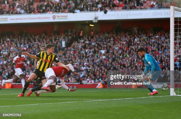 Craig Cathcart of Watford scores an own goal past goakeeper Ben Foster during the Premier League match between Arsenal FC and Watford FC at Emirates...