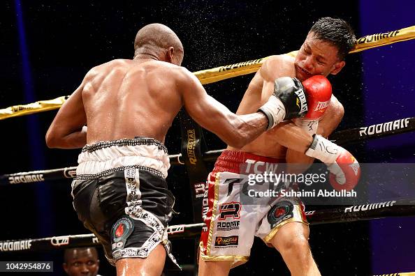 Muhammad Ridhwan Muhamad Ridhwan of Singapore fights Paulus Ambunda of Namibia in the ...
