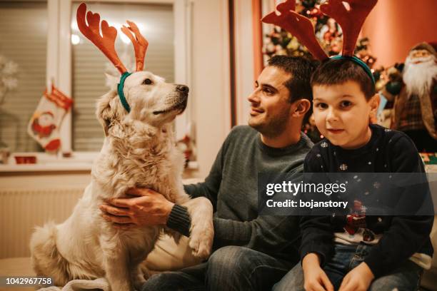 happy family on christmas - reindeer horns stock pictures, royalty-free photos & images