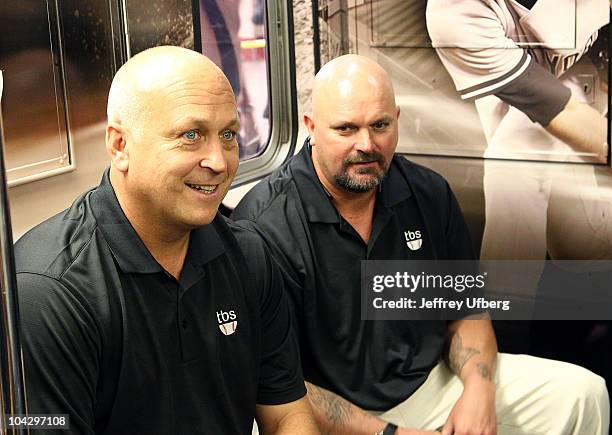 Former MLB players Cal Ripkin, Jr. And David Wells attend the MLB On TBS 42nd Street Times Square shuttle unveiling at Grand Central Station on...