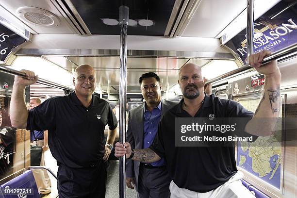 Former professional baseball players Cal Ripkin Jr., David Wells and Ron Darling attend the MLB on TBS 42nd Street Times Square shuttle unveiling at...