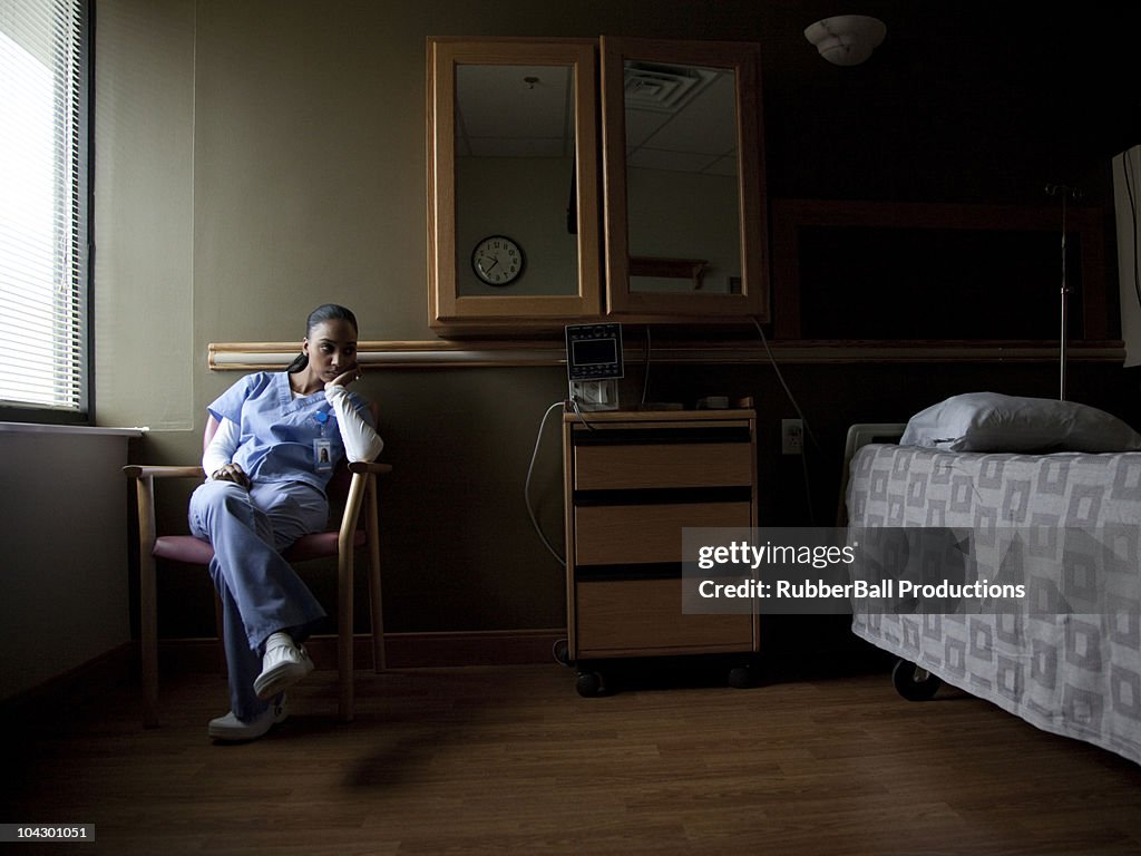 USA, Utah, Payson, Young nurse contemplating