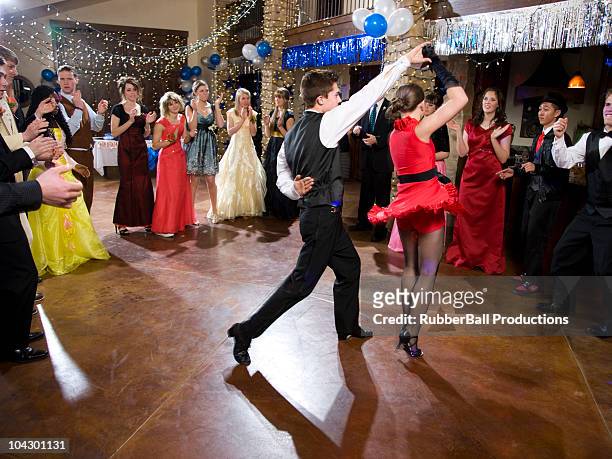usa, utah, cedar hills, teenagers (14-17) dancing at high school prom - prom dress stockfoto's en -beelden
