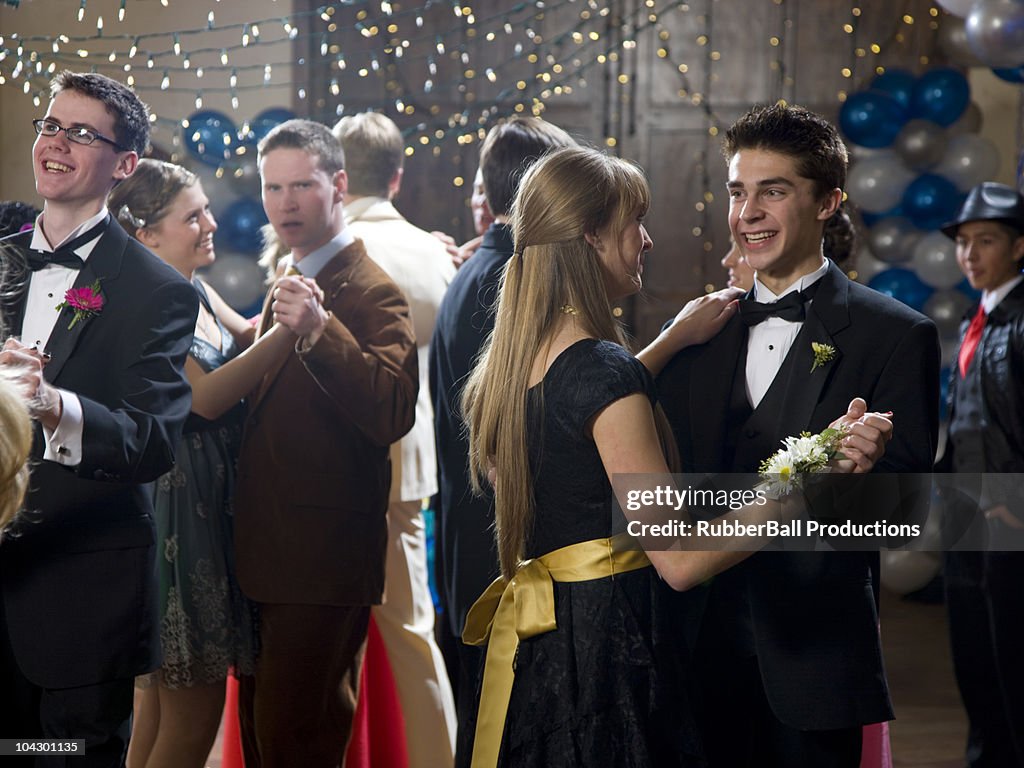 USA, Utah, Cedar Hills, Teenage couples (14-17) dancing at high school prom