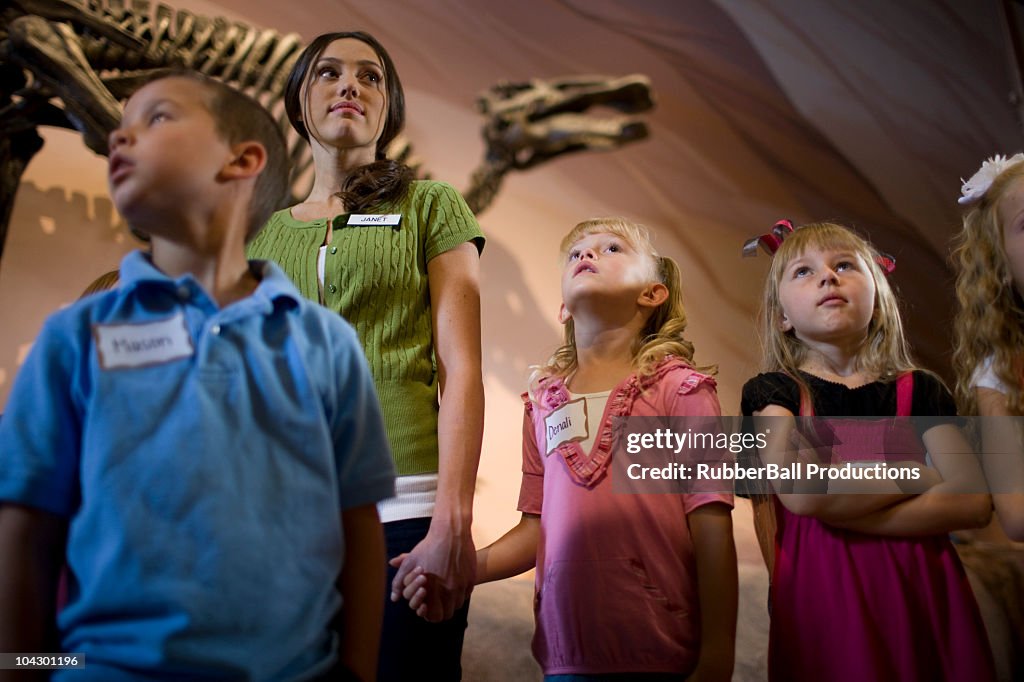 USA, Utah, Lehi, teacher with children (6-9) at museum