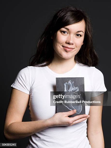 woman with a drawing of a heart - chalk heart stock pictures, royalty-free photos & images