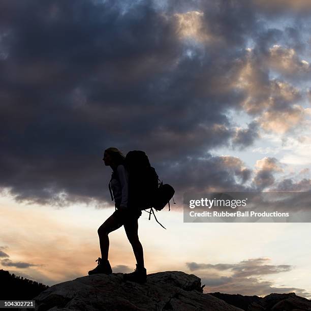 woman backpacking along a ridge - alta utah stock pictures, royalty-free photos & images