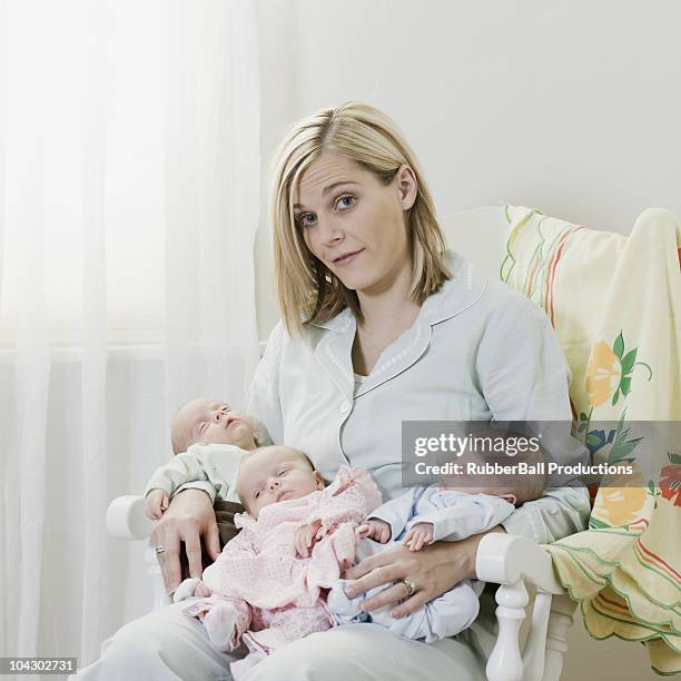 mother with newborn triplets - triplet girls stock pictures, royalty-free photos & images