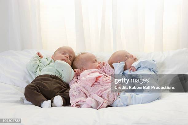 newborn triplets asleep - triplet stock pictures, royalty-free photos & images