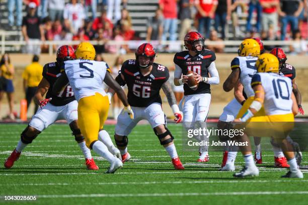 Alan Bowman of the Texas Tech Red Raiders passes the ball during the first half of the game against the West Virginia Mountaineers on September 29,...