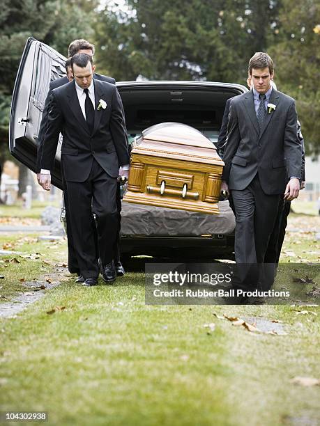 pallbearers carrying a casket - funeral procession stock pictures, royalty-free photos & images