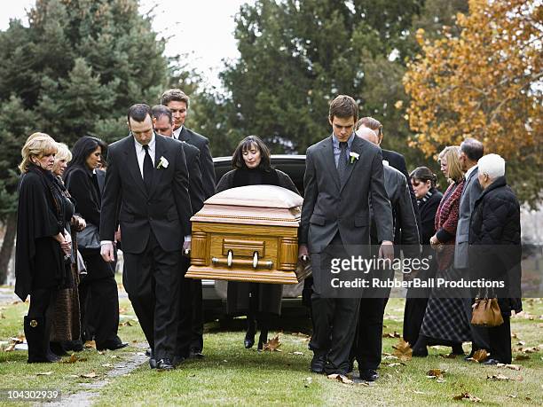 people at a funeral - hearse stockfoto's en -beelden